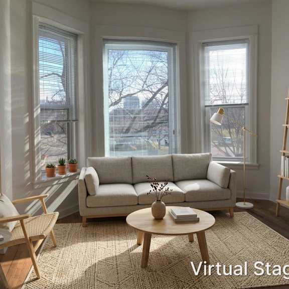 a living room with a couch, chair, and coffee table.