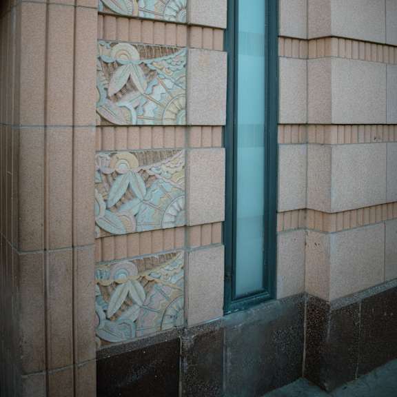 a wall with a patterned design on it.
