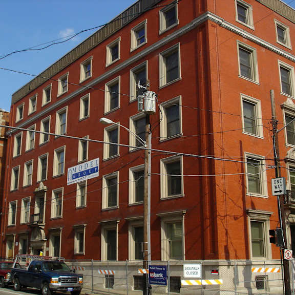 a large red building on a city street