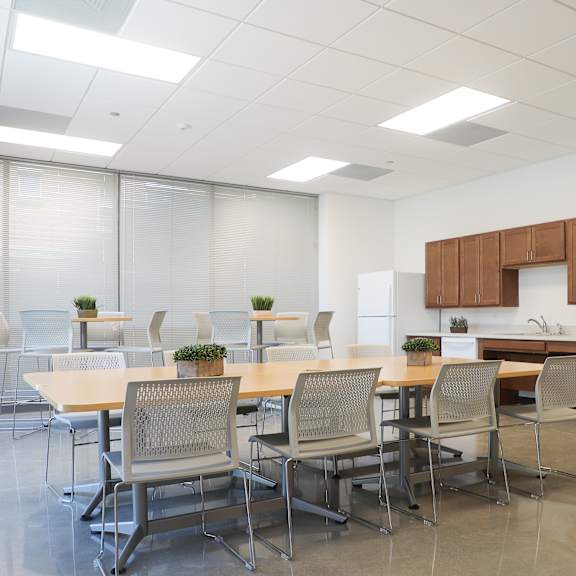 a conference room with a long table and chairs.