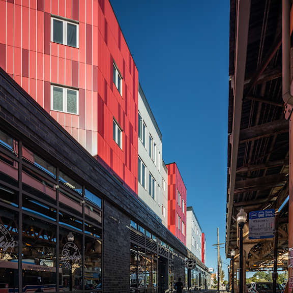 a red building with a clear blue sky in the background.