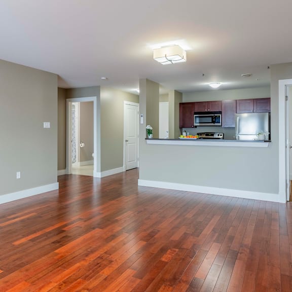 a kitchen area with a microwave, oven, and refrigerator.