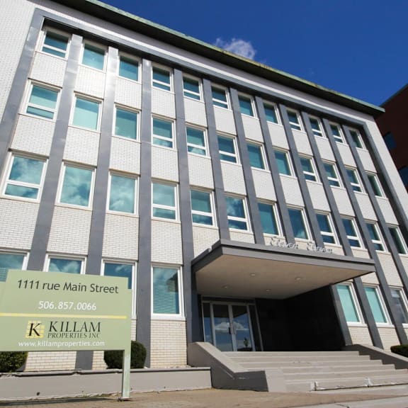 a building with a sign that says killam properties.