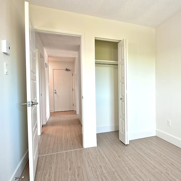 a room with a white door and a white wall.