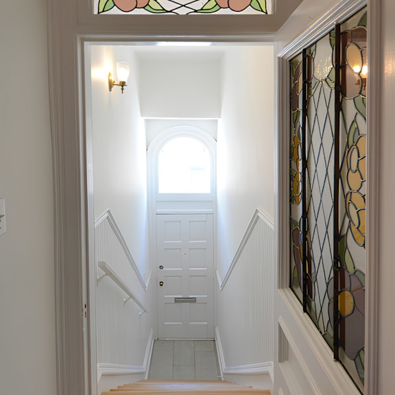 a staircase with a glass window in the middle.
