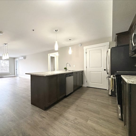 a kitchen with a large island and modern appliances.