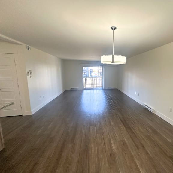 a room with wooden floors and a white ceiling.