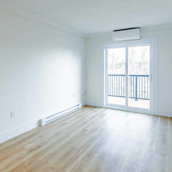 a room with a window and a balcony.