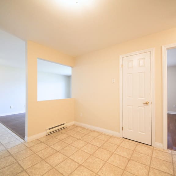 a room with a white door and a window.