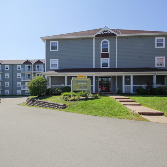 a large building with a sign in front of it.