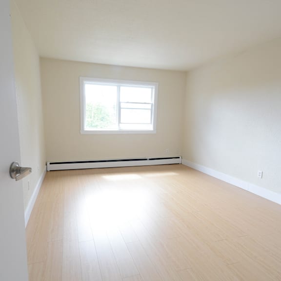 a room with a window and a door.