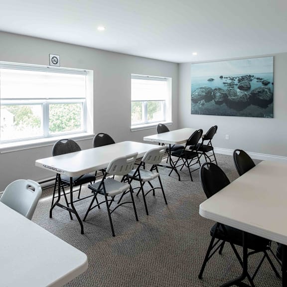 a conference room with a long table and chairs.