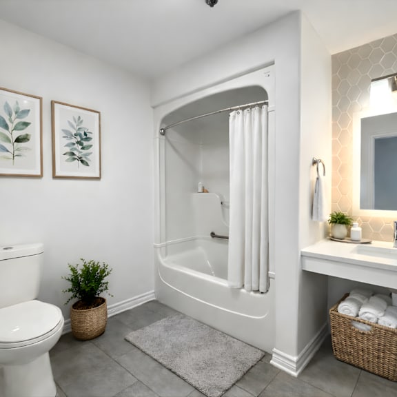 a white bathroom with a toilet, a sink, a mirror, and a potted plant.