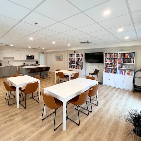a kitchen with a dining table and chairs.