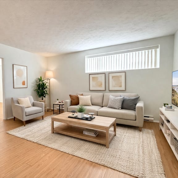 a living room with a couch, chair, and coffee table.