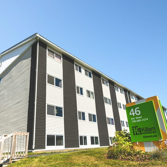 a large building with the number 46 on a sign in front of it.