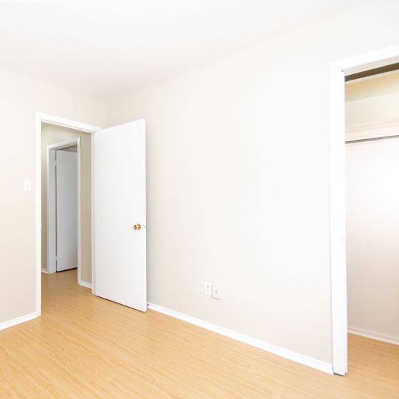 a room with a white door and a white wall.