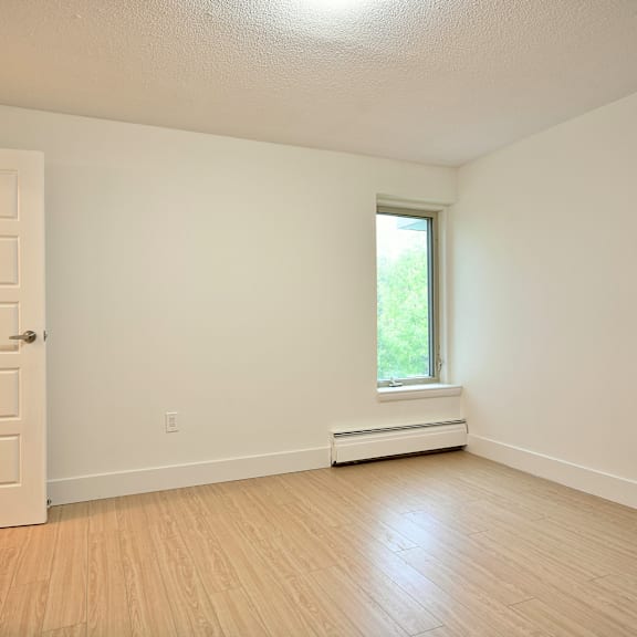 a room with a window and a door.