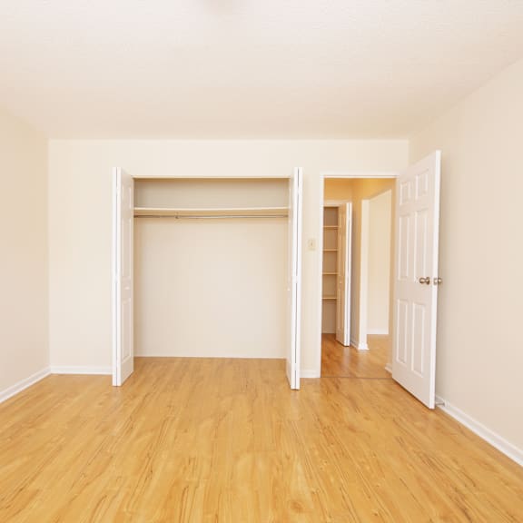 a room with a white door and a white wall.