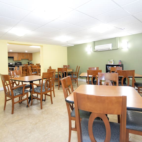 a room with tables and chairs.