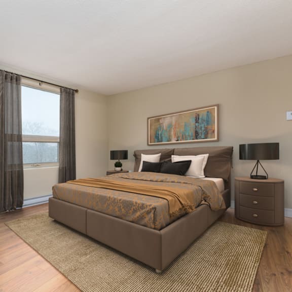 a bedroom with a large bed, nightstand, and a painting on the wall.