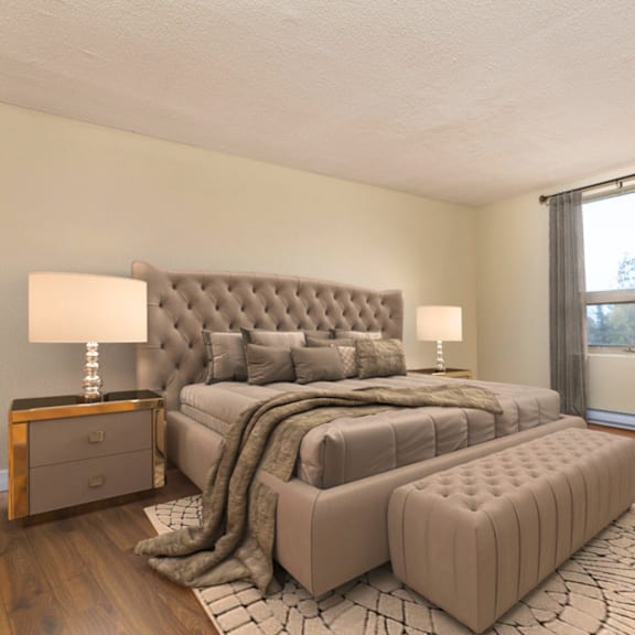 a bedroom with a large bed and a window with curtains.