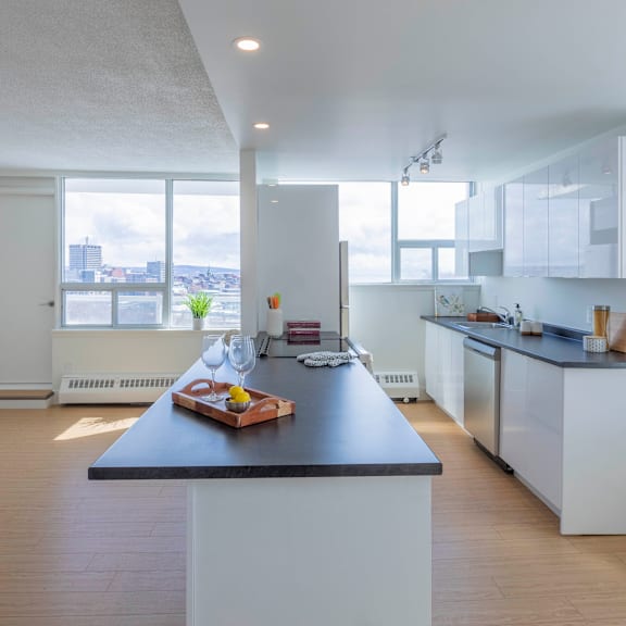 a modern kitchen with a large island in the center.
