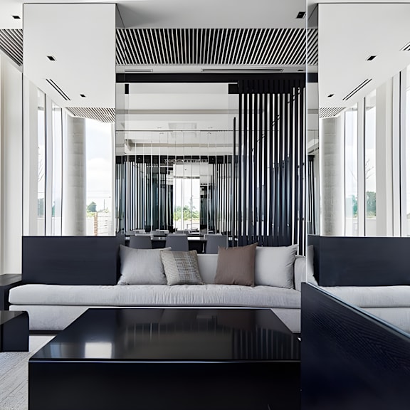 a modern living room with a black and white color scheme.