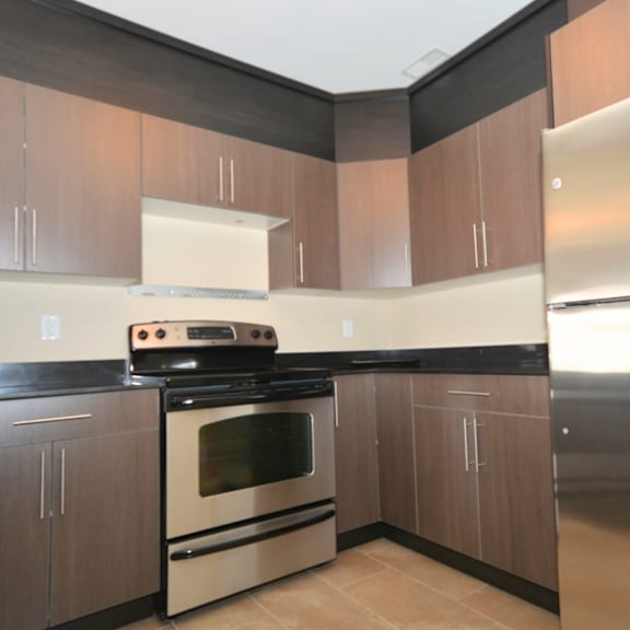a kitchen with a stove and cabinets.