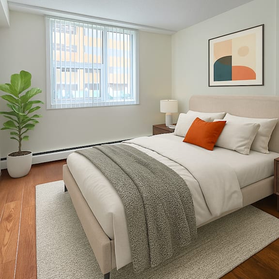 a bedroom with a large bed, a potted plant, and a painting on the wall.