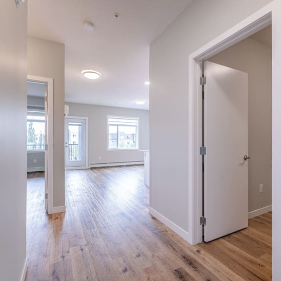 a room with a white door and a window.