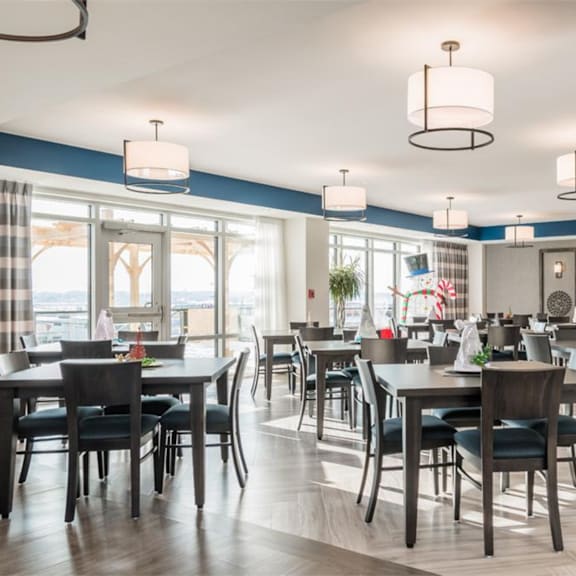 a modern dining room with a large table and chairs.
