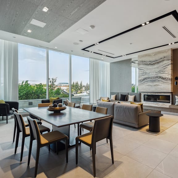 a modern dining room with a large table and chairs.