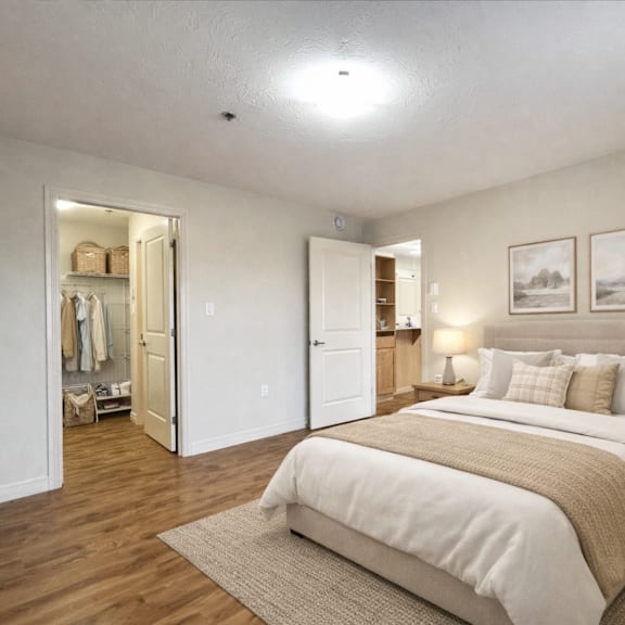 a bedroom with a large bed and a wardrobe.