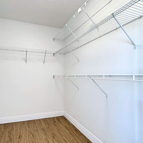 empty room with white walls and wooden floor.