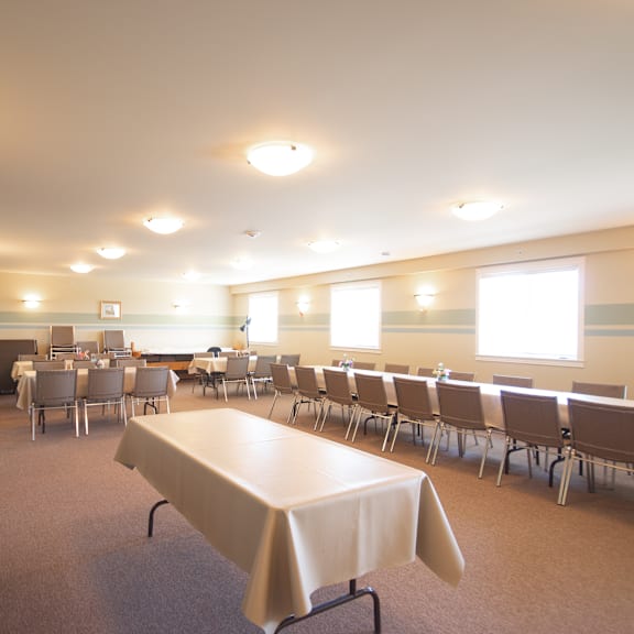 a conference room with a long table and chairs.