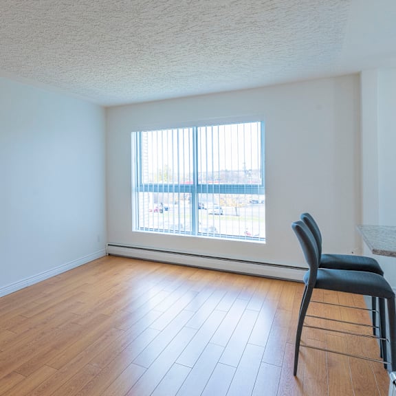 a room with a chair and a window.