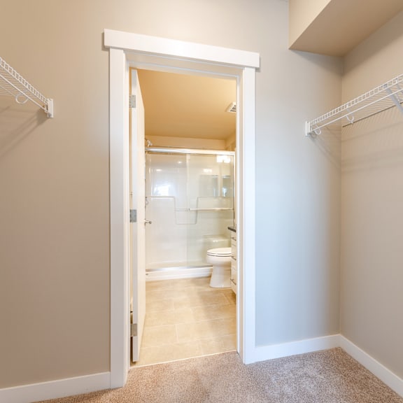 a white bathroom with a toilet and sink.