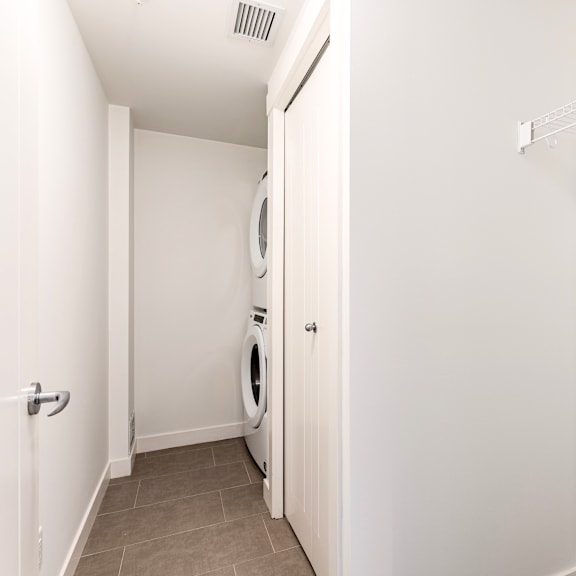 a laundry room with a washer and dryer.