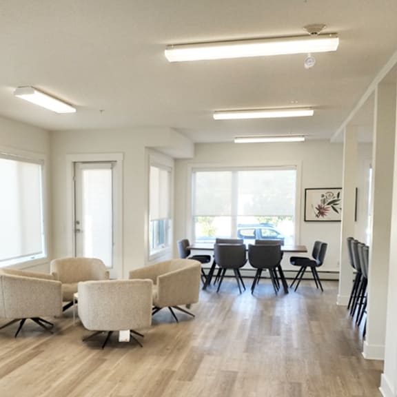 a room with a table and chairs.