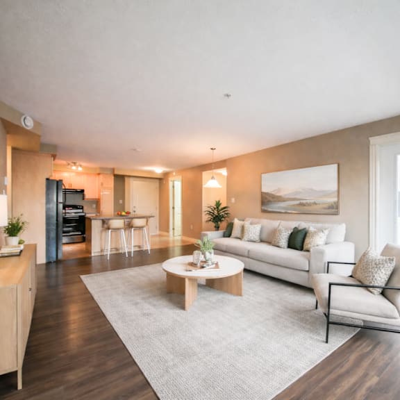a modern living room with a white sofa and a coffee table.