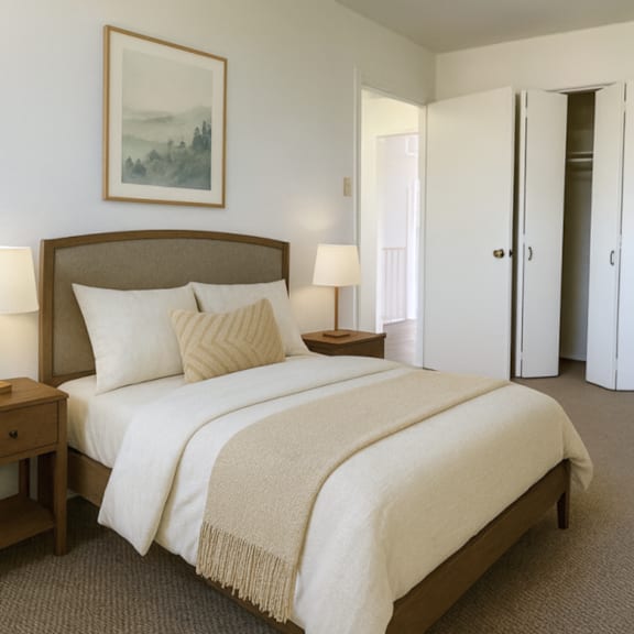 a bedroom with a large bed and a painting on the wall.