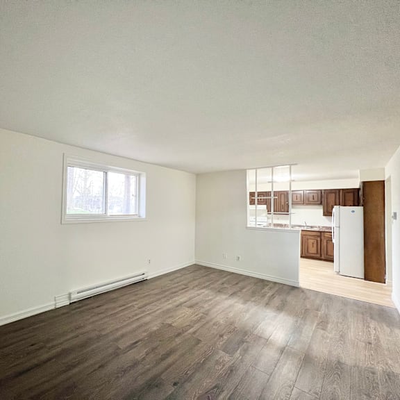 a room with a white wall and a window.