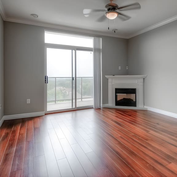a room with a fireplace and sliding glass doors.