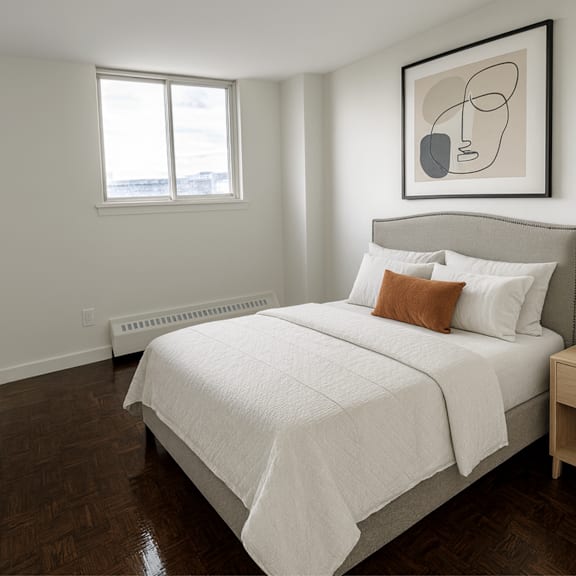 a bedroom with a large bed and a painting above it.