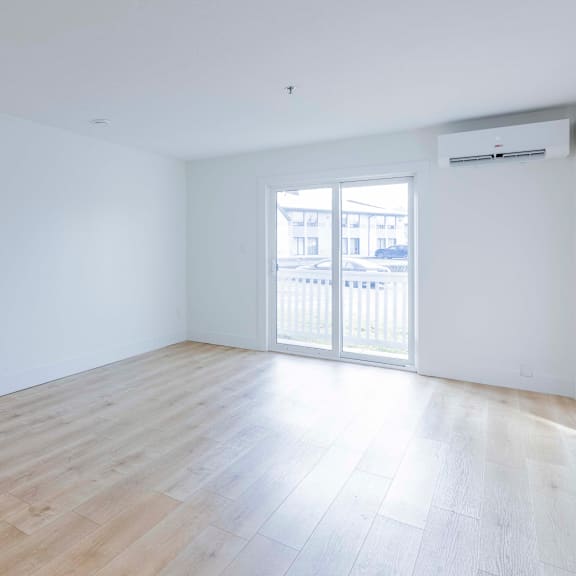 a room with a sliding door and a window.
