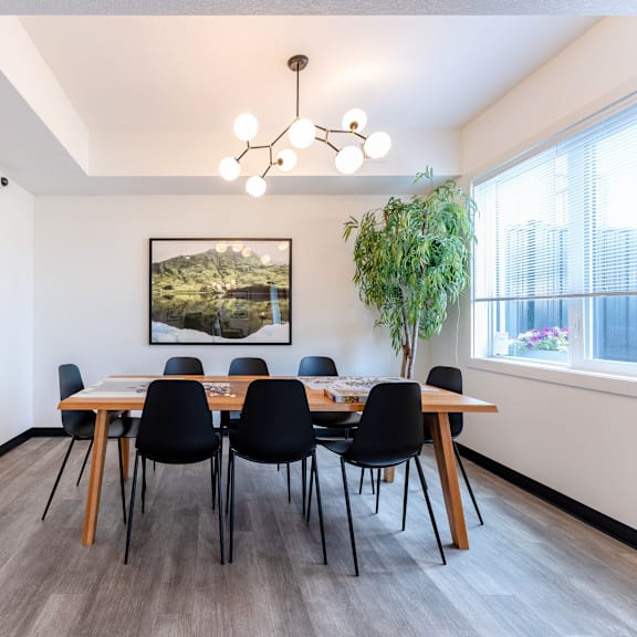 a dining room with a wooden table and chairs.