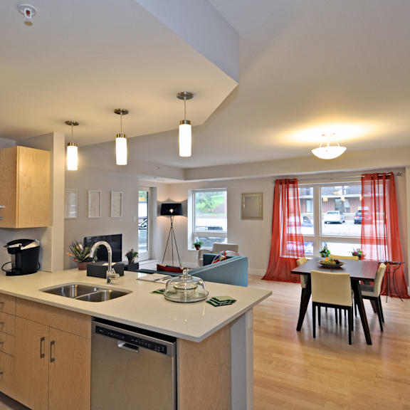 a kitchen with wooden cabinets and a white countertop.