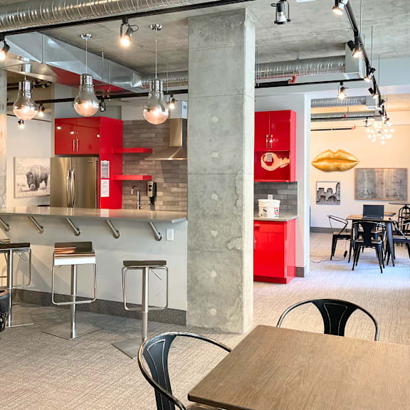a modern interior with a red cabinet and a concrete pillar.