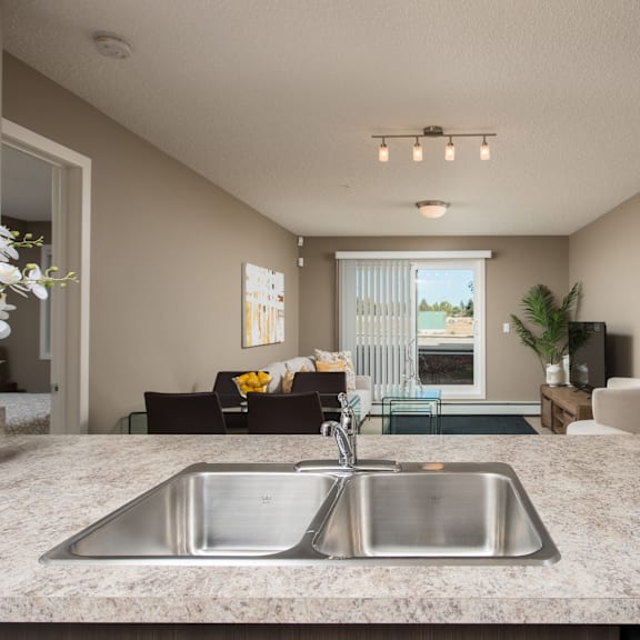 a kitchen with a sink and a window.
